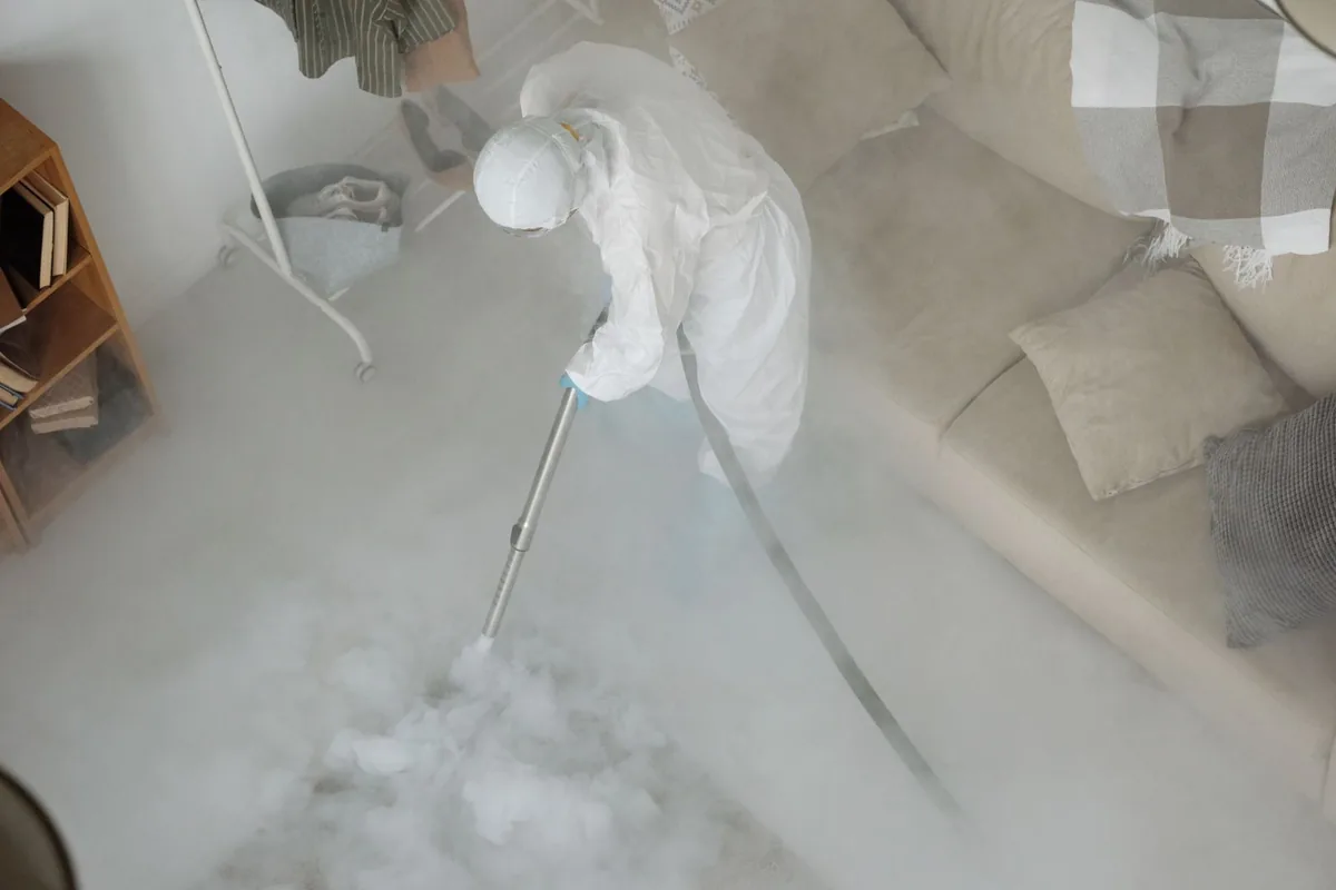 Biohazard cleanup technician in protective equipment, Elsa, TX